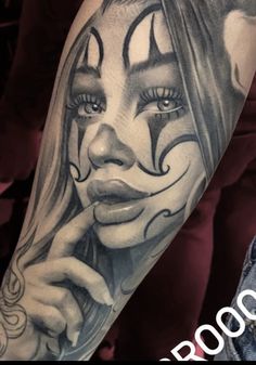 a woman with makeup on her face is shown in this tattoo art photo taken by the artist