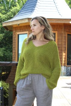 Hand knit Alpaca wool V-neck sweater pullover features dropped shoulder , relaxed fit , V-neck line .Absolutely itch free ! Made of 90% Peruvian alpaca and Merino wool blend. Very soft and warm. Peruvian Alpaca is well known for unique quality and softness. Model is size M and wearing size M/L. Recommended care : Hand wash and Lay flat to dry. Oversized Green V-neck Sweater, Relaxed Fit Knit V-neck Sweater, Green V-neck Knitted Sweater, Relaxed Fit V-neck Sweater, Cozy Green V-neck Sweater, Cozy V-neck Sweater With Soft Knit And Relaxed Fit, Cozy V-neck Sweater With Relaxed Fit, Cozy V-neck Relaxed Fit Sweater, Cozy Relaxed Fit V-neck Sweater