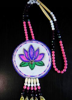 the beaded necklace is decorated with flowers and beads