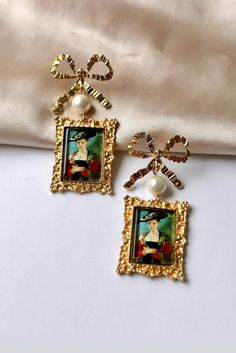 Are you looking for the perfect oil painting earrings for someone special this summer? Or a unique pair of vintage bow earrings to spoil yourself? Made with stainless steel pins, delicate pearl beads and repurposed vintage portrait charms, my coquette earrings are the perfect compliment to any outfit idea! My portrait earrings are a great gift idea for any special occasion to all the women in your life. You can't go wrong when gifting my antique pearl earrings to your bestie, wife or sister! DET Portrait Earrings, Coquette Earrings, Painting Earrings, Earrings Outfit, Portrait Vintage, Vintage Portrait, Vintage Style Earrings, Earrings Antique, Ringe Gold