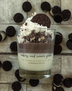 an oreo cookie and cream dessert in a glass with chocolate chips on the side