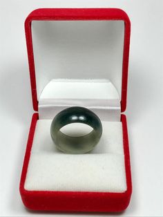 This jadeite ring band outer is rounded and and flatten on the inside by hand. This jade band is untreated Type-A jadeite jade. It has been polished on the inside and outside. The photos have not been altered or changed at all. *Ring Band Shape: Flat Inner, Round Outer *Color: Icy Deep Apple Green Moss-In-Snow *Luster: Vitreous *Transparency: Translucent *Inside Width: 7 3/4 US *Width: 10.5mm *Size: Medium *Texture: Fine and No Flaws *Free standard shipping from Thailand *Comes with a beautiful Adjustable Jade Ring, Classic Green Crystal Ring, Vintage Round Jade Rings, Formal Adjustable Emerald Ring, Adjustable Formal Emerald Ring, Adjustable Emerald Ring For Formal Occasions, Jadeite Ring, Jade Bangle, Jade Ring