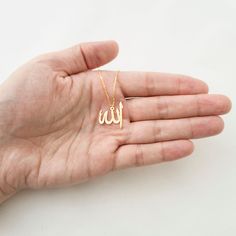 This necklace is a piece of our new collection of Allah necklace made from sterling silver and 14k gold. The collection includes different designs that suit all tastes Kufi/calligraphy, heart/rectangle/triangle shapes, tiny/big sizes. Here is the link for the full collection: https://etsy.me/2Swd0lP All the designs can be made as necklace, bracelet, and earrings. If you also want a complete set that includes a necklace, a bracelet and earrings please get in touch with us. We accept custom orders Kufi Calligraphy, Allah Necklace, Calligraphy Heart, Allah Pendant, Skin Craft, Arabic Jewelry, Islamic Jewelry, Minimal Gold, Letter Ring