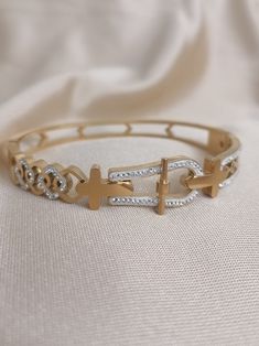 cross pattern bracelet.women's bracelet.girl's bracelet.gift bracelet.Cross patterned bracelet. A piece of jewelry that you can gift to your loved ones or that will suit you very well.mom day gift. Sister gift. Birthday gifts  html {      } https://worldshopping34.etsy.com Gold Stainless Steel Bracelets As Fashion Accessory, Gold Stainless Steel Bracelet As Fashion Accessory, Customizable Stainless Steel Bracelets, Luxury Gold Bracelet As Gift, Metal Cross Bracelets, Gold Metal Rosary Bracelet As Gift, Metal Rosary Bracelet As Gift, Gold Metal Rosary Bracelet For Gift, Luxury Gold Metal Bracelet As Gift