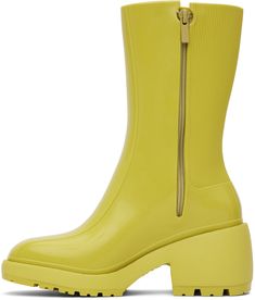 Mid-calf Melflex® PVC boots in green. · Square toe · Logo embossed at outer side · Zip closure at inner side · Ribbed detailing at heel counter · Padded thermal footbed · Textured foam rubber midsole and block heel · Treaded EVA rubber outsole · Platform: H0.7 in · Heel: H2.5 Supplier color: Green Synthetic Block Heel Summer Boots, Summer Synthetic Boots With Block Heel, Summer Synthetic Block Heel Boots, Green Ankle-high Summer Boots, Summer Ankle-high Green Boots, Summer Green Ankle-high Boots, Green Platform Boots For Spring, Green Ankle Boots For Spring, Green Ankle Boots With Lug Sole