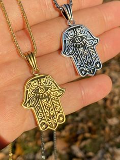 "Beautifully Hand crafted Hamsa pendants **IF YOU WANT A PENDANT ONLY AND NO CHAIN, PLEASE SELECT \"0\" CHAIN LENGTH** Solid 925 sterling silver! Unique custom made one of a kind! We have 2 styles! Rhodium finished & 14k yellow gold finished! Gold is vermeil bonded to solid silver underneath so color wont fade or tarnish Both are oxidized (blackened to give a more vintage look) Pendant measures roughly 1.25\" by 1.25\" (1.75\" w. bale)...weighs roughly 10.5 grams! 100% 925 silver...not plate Gold Sterling Silver Spiritual Jewelry, Spiritual Gold Sterling Silver Jewelry, Nickel Free 14k Gold Jewelry For Gifts, Personalized Brass Amulet Jewelry, Spiritual Silver Charm Necklace As Gift, Silver Brass Charm Necklace, Silver Brass Charm Necklace With Lobster Clasp, Symbolic Charm Necklaces With Lobster Clasp As A Gift, Symbolic Charm Necklaces With Lobster Clasp For Gift