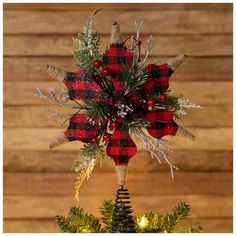 a red and black plaid christmas tree topper