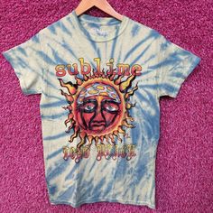 Sublime Swirl Tiedye Sun Logo Rock Tee Size Small Generally Measures 17 Inches Pit To Pit And 27 Inche Long Never Worn First Hand Overstock Great Condition With An Amazing One Of A Kind Graphic For Fans Of The Legendary Long Beach Rock Band, Sublime. Has Markings From The Manufacturing Process That Could Possibly Wash Off Bohemian Blue T-shirt For Summer, Blue Bohemian T-shirt For Summer, Bohemian Streetwear Tops For Summer, Summer Acid Wash Hand Dyed T-shirt, Hippie Style Summer Streetwear T-shirt, Summer Hippie Streetwear T-shirt, Summer Tie-dye T-shirt With Screen Print, Summer Tie Dye T-shirt With Screen Print, Summer Tie Dye Soft-washed T-shirt