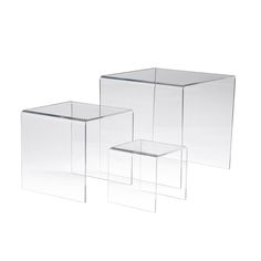 three clear acrylic tables on white background