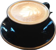 a cappuccino in a black saucer on a white background with gold trim