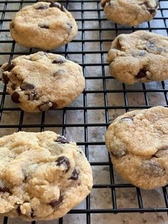 chocolate chip cookies cooling on a rack in the kitchen, ready to be baked or eaten