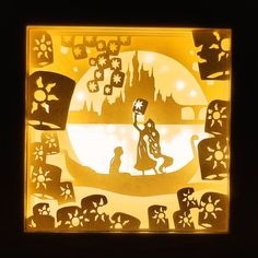 a paper cut artwork depicting a woman and her dog