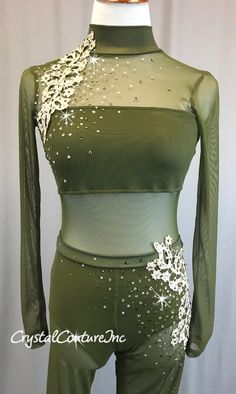 a green top and pants with white stars on it