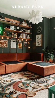 a living room filled with lots of furniture and bookshelves on top of shelves