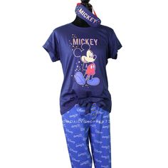 This Is A Brand New Disney Women's 3-Piece "Stellar" Mickey Mouse Pj Gift Set. The Top Features A Navy Blue Color With Glitter "Mickey" Lettering Above A Large Image Of Mickey Mouse Outlined In Sparkly Gold Glitter With Gold Glitter Stars Surrounding Him. The Matching Sleep Mask Has Mickey Lettering And Stars In Gold Glitter. The Pants Are Blue With A Disney Logo Pattern, Large Navy Bow, And Gold Glitter Buttons. Disney X Primark Exclusive. Us Women's Sizes: Xs S M L New To Poshmark? Use The Inv Cute Blue Fitted Sleepwear, Casual Minnie Mouse Sleepwear For Pajama Party, Blue Character Print Sleepwear For Pajama Party, Fitted Playful Blue Sleepwear, Playful Fitted Blue Sleepwear, Blue Character Print Loungewear Sets, Mickey Mouse Outline, Casual Minnie Mouse Sleepwear For Loungewear, Blue Character Print Sleepwear