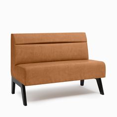 a brown couch sitting on top of a wooden frame