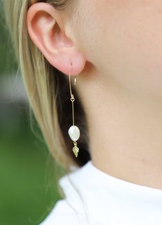 A timeless fresh-water pearl sways at the base of a real 14K gold-filled solid wire. A gold leaf dangles for added elegance. Why do you need gold-filled jewelry? It will not tarnish. It's friendly to sensitive ears because it contains ~100x more gold than gold-plated jewelry. This is not costume jewelry. You'll be able to keep this set for years to come. Perfect for the minimalist and classy bride. These earrings also make an excellent gift for mother's day. Toutietou earrings are great for Firs 14k Yellow Gold Filled Dangle Pearl Earrings, Delicate Gold Threader Earrings With Pearl Charm, Gold Teardrop Pearl Linear Earrings, Delicate Gold Linear Earrings With Pearl Drop, Yellow Gold Threader Earrings With Pearl Drop, Yellow Gold Long Drop Threader Earrings With Pearl Drop, Dainty Gold Linear Earrings With Pearl Charm, 14k Gold-filled Yellow Gold Drop Pearl Earrings, Gold Teardrop Linear Earrings With Pearl Charm