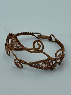 An elaborately wire wrapped copper bracelet. About 6 inches around. Wire Wrapped Bracelet, Copper Bracelet, Copper Wire, Wire Wrapped, Wrap Bracelet, Wire Wrapping, 6 Inches, Cuff Bracelets, Jewelry Bracelets