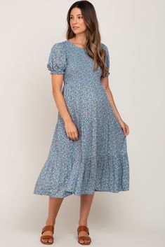 A comfortable & casual maternity dress perfect for any day!  A floral print maternity midi dress with a smocked bodice, puff sleeves and ruffle hem. Pocketed. The Blue Floral Smocked Maternity Midi Dress is perfectly bump-friendly! Casual Tiered Maternity Dress, Summer Maternity Midi Dress With Smocked Back, Spring Maternity Dress With Smocked Bodice And Short Sleeves, Short Sleeve Maternity Dress With Smocked Bodice, Fitted Maternity Dress With Smocked Back, Modest Floral Print Dress With Puff Sleeves, Modest Floral Dress For Brunch, Maternity Midi Dress With Smocked Back, Spring Casual Tiered Maternity Dress