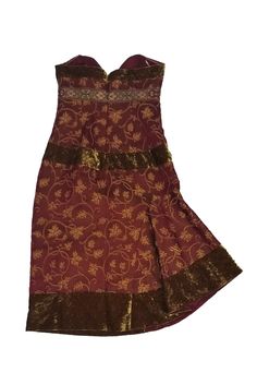 This enchanting dress is make in a red satin fabric with a gold paisley print. Trimmed with embroidery and velvet accents, this dress is bound to wow. Looks great paired with gold-tone accessories. Size 8 55% rayon, 45% silk Made in U.S.A Strapless Back zipper Sweet heart neckline Gold velvet trim Paisley print Embroidered trim below bust Empire waist Lined Bust 32" Waist 28" Shoulder to hem 37.5" Gold Velvet Evening Dress, Elegant Evening Festival Dresses, Gold Velvet Party Dress, Elegant Evening Dresses For Festivals, Elegant Brocade Dress For Festivals, Red Brocade Party Dress, Festive Red Brocade Dress, Elegant Velvet Dress For Fancy Occasions, Red Fitted Brocade Dress