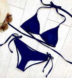 "FREE SHIPPING TO USA FOR ALL ORDERS OVER 35$! Choose right size by following our size chart below, thank you! We use FEDEX PRIORITY shipping service to the United States to guarantee the fastest delivery in 3-4 days. Flattering triangle bikini set in dark blue. Adjustable top with ties at neck and back. Side tie bikini bottoms. Stretchy and body fitting material. COLOR: DARK BLUE MEASUREMENTS (fit si very adjustable): Size 2 - Bust - 33\" (83-84 CM) - Hips - 34\" - 35\" (89-90 CM) - Waist - 23\ Dark Blue Swimsuit, Blue Bathing Suit, Neon Bikinis, Star Clothing, High Waisted Swim, Blue Swimsuit, Cute Bikinis, Swim Wear, Swim Suit