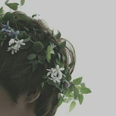 a woman with a flower crown on her head