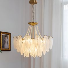 This Glass Feather Pearl Chandelier offers a unique blend of style and functionality. Its distinctive feather shape and wrought iron lines and circles provide a sense of depth and hierarchy while the leaves texture glass lampshade provides a gentle, non-glaring light. Perfect for any room. Light Source Six 15 watt maximum medium (E14) bulb required. (Not included bulbs) Dimmable with compatible dimming bulbs. Measurements 6 Heads: D 19.7 x H 10.2″ 6 Heads: D 23.6 x H 11″ 9 Heads: D 23.6 x H 11.8 Leaves Texture, Glass Feather, Living Room Light Fixtures, Pearl Chandelier, Dining Room Pendant, Pendant Lighting Dining Room, Pearl Accessories, Glass Lampshade, Leaf Texture