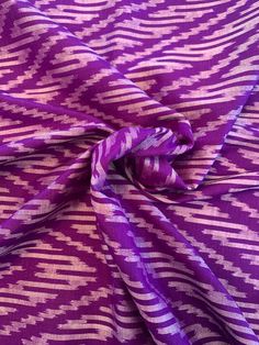 a purple and white fabric with an interesting design on it's side, that is very soft