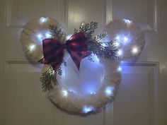 a mickey mouse wreath with lights on it