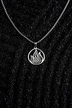 FIRE🔥 The strongest of the four nations, we hope this pendant helps the wearer tap into the powerful force and unflinching will that make fire benders so impressive. Materials: Stainless steel, comes with a 2mm rounded box chain. Pendant dimensions: Approx. .75" by .75" Fire Jewelry Design, 4 Elements, Fire Nation, Symbol Necklace, Round Box, Hand Jewelry, Aang, Chain Pendant, Box Chain