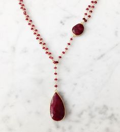 Diana Necklace Ruby with Ruby Drop / Ruby | A Blonde and Her Bag The Diana Montecito Necklace is a long, 28" plus 6" drop in length, semi- precious stone necklace An 18k gold vermeil bezel set central round semi- precious stone | 1-800-Flowers Gifts Delivery Diana Necklace Ruby W/ Ruby Drop Diana Necklace, Necklace Ruby, Beaded Chain Necklace, Ruby Beads, Ruby Stone, Pendant Set, Blue Crystals, Faceted Bead, Beaded Chain