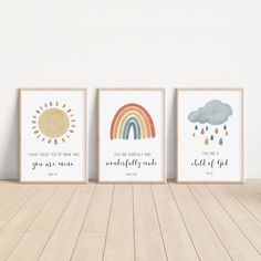 three framed art prints featuring rainbows, clouds and rain