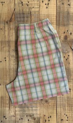 "Awesome high waisted 90's plaid shorts. High waisted fit, looser through the hips, and two front pockets. Button and zipper closure in front. Classic 90's multi colored plaid pattern. Shorts are in excellent clean condition. Measurements are taken zipped or buttoned up and laid comfortably flat then x 2 for total circumference (inches) Liz Claiborne Tag Size 10 100% Cotton Waist 28\" Hips 42\" Length 16.5\" Inseam 5\" Rise 12\" Bottom leg Opening Circumference 26\" All items are free of rips, t Cheap Plaid Shorts, Summer Plaid Shorts With Built-in Shorts, Casual Plaid Bottoms With Built-in Shorts, High Waist Plaid Cotton Bottoms, Fitted Casual Plaid Shorts, Fitted Plaid Casual Shorts, Plaid Bottoms With Built-in Shorts, High-waisted Plaid Bottoms With Built-in Shorts, Fitted Plaid Shorts