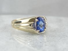 Vintage Men's Ring with Deep Blue Tanzanite Timeless Blue Signet Ring With Polished Finish, Timeless Blue Gemstone Signet Ring, Formal Sapphire Oval Signet Ring, Formal Oval Sapphire Signet Ring, Classic Royal Blue Sapphire Ring For Formal Occasions, Blue Oval Signet Ring For Formal Occasions, Vintage Blue Oval Sapphire Ring, Classic Royal Blue Rings For Formal Occasions, Formal Sapphire Signet Ring With Gemstone