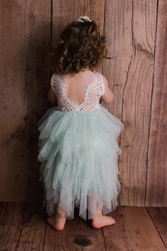 This dress is just beautiful! It includes a delicate white lace bodice with tiered mint green tutu skirt. It also has an embellished sash on the front that is not removable. The V Back with unfinished lace adds the perfect amount of boho chic look to this amazing Tea length dress. Perfect for your next special event. Nicolette's Couture is a family owned boutique based out of Dubuque, Iowa. When creating looks, comfort is our main priority...regardless of how chic a style is. Our popular special Beach Flower Girl Dresses, Dubuque Iowa, Flower Girl Proposal, Lace Flower Girl Dress, Green Tutu, Look Boho Chic, Tulle Wedding Gown, Heirloom Dresses