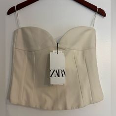 Nwt Zara Beautiful Strapless Corset Top With Sweetheart Neckline. Very Elegant !! Size M Lined New With Tags Color: Ecru Bustier With A Sweetheart Neckline And Exposed Shoulders. Invisible Back Zip Fastening. 68% Polyester 29% Viscose 3% Elastane Sz M Stock#4257 Chic White Corset With Built-in Bra, White Fitted Tube Top With Built-in Bra, Chic White Corset For Night Out, Chic White Top With Sweetheart Neckline, White Fitted Strapless Crop Top, Chic White Bandeau Crop Top, White Bandeau Top For Night Out, Chic White Summer Corset, Chic White Corset For Summer