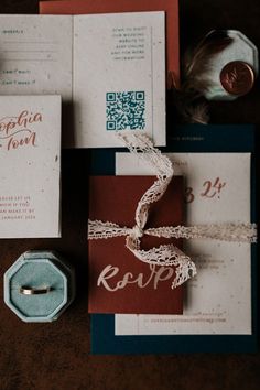 the wedding stationery is laid out and ready to be used as an alternative for the bride's ring