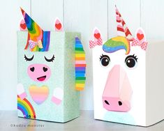 two paper bags with unicorns on them sitting next to each other