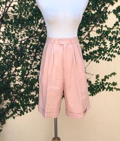 "High waisted Bermuda shorts by David Hollis in a beautiful pink color linen fee rayon blend with two side pockets. Button and zipper front closure.  Marked size 10. Ramie/Rayon blend  Great vintage condition! Measurements (flat): waist: 28\" hips: 40\" overall length: 21\" rise: 14\" inseam: 8\"" Pink Linen Bottoms For Spring, Pink High-waisted Shorts With Pockets, Pink Short Length Pants For Spring, Pink High-waisted Bermuda Shorts For Spring, Casual Pink Linen Shorts, Pink Short Pants With Pockets, Short Pink Pants With Pockets, Pink Bermuda Shorts For Summer, Pink Linen Shorts For Summer