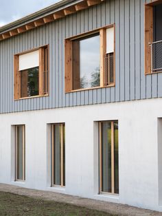 the side of a building with three windows