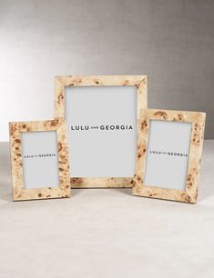 three wooden frames sitting on top of a table