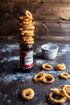 a bottle of beer and some pretzels on a table