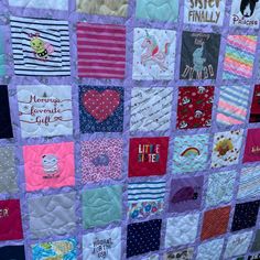 a quilt made to look like it has many different patches on it and words written in each patch