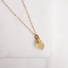 Citrine necklace - November Birthstone Necklace - Citrine Jewelry - Citrine Birthstone - Born in November - Mother's Day Jewelry - Dainty From our collection of natural raw birthstone necklaces. The Citrine is November's birthstone. Because of the natural raw origin of our stones, all these necklaces are unique and the shape and size of the stone will vary slightly from the one in the photos. Chain: 14k gold filled Clasp: Spring Ring Length: 16 inches Stone: Raw natural Citrine Stone: 9mm x 7mm Everyday Gold Necklace With Raw Stone, Gold Necklace With Raw Stone For Everyday, Teardrop Birthstone Jewelry For Healing, Healing Birthstone Teardrop Jewelry, Delicate Birthstone Crystal Necklace For Everyday, Spiritual Citrine Birthstone Necklace, Delicate Everyday Birthstone Crystal Necklace, Delicate Birthstone Crystal Necklace, Spiritual Citrine Pendant Necklace