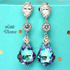 "These gorgeous and timeless Swarovski Vitrail Light Earrings have a Victorian touch of elegance and romance. The baroque pendants have classic scroll-shaped silhouettes and are precision beveled/faceted to enhance the color and characteristic of the crystal, making each piece a glistening treasure! Perfect for brides, bridesmaids and special occasions! Earrings made with: - 22mm GENUINE Swarovski Vitrail Light Baroque crystals. The crystals emit so much shine and sparkle as it changes colors at Elegant Lavender Earrings For Party, Purple Drop Chandelier Earrings For Formal Occasions, Lavender Drop Earrings For Formal Occasions, Lavender Drop Earrings For Party, Formal Purple Clip-on Jewelry, Elegant Purple Dangle Chandelier Earrings, Purple Crystal Earrings For Wedding, Purple Teardrop Chandelier Earrings As Gift, Purple Dangle Bridal Earrings For Formal Occasions