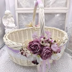 a wicker basket with flowers in it