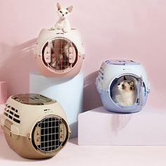 three different types of pet carriers sitting on top of each other in front of a pink wall