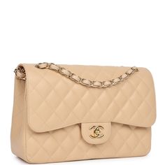 This Jumbo Classic Double Flap bag is in beige caviar leather with gold tone hardware and features a front flap with signature CC turnlock closure, half moon back pocket, and adjustable interwoven gold tone chain link and beige leather shoulder strap.The interior is lined in beige leather with a "love letter" zipper compartment under the first flap, an "outer" slit pocket under the second flap, and an interior compartment with two open pockets separated by a "lipstick" compartment.Collection: 19-series (2014) Origin: FranceCondition: Never wornAccompanied by: Chanel box, Chanel dustbag, carebook, felt, COA card, retail UPCMeasurements: 12" width x 8" height x 3.5" depth; 23" strap drop: 23" (13" doubled) Ck Bags, Chanel Jumbo, Chanel Box, Crossbody Handbags, Gold Chanel, Stylish Shoulder Bag, Handbags Women, Purse Crossbody, Leather Thread