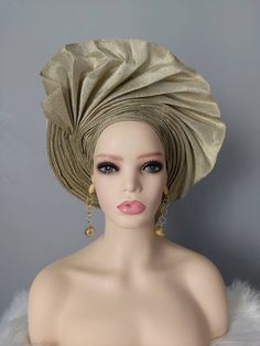 Material: Aso Oke Colour: Champagne Gold This beautiful ready to wear Nigerian head tie can be rocked to any party or special occasion. This headwrap will be a perfect gift idea. Please note colour may appear slightly different from physical product due to image capture settings. You can check our store for various beautiful items. https://www.etsy.com/uk/shop/YettyPrizesTextile Thanks for visiting our shop! Bohemian Party Headband Headwrap, Bohemian Headwrap Headband For Party, Summer Bohemian Party Headscarf, Bohemian Summer Party Headscarf, Gold Headwrap Headband For Party, Adjustable Gold Headscarf For Party, Green Adjustable Headwrap For Party, Elegant Green Headwrap For Party, Adjustable Summer Party Turban