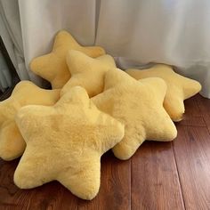 four yellow stars are laying on the floor